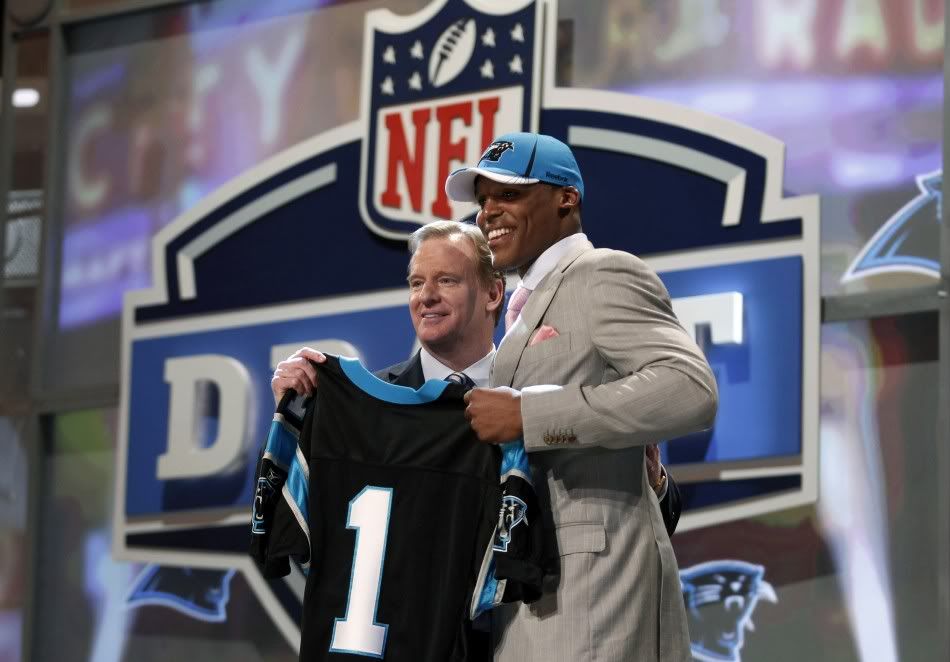 92966-quarterback-cam-newton-of-auburn-university-stands-with-nfl-commission.jpg